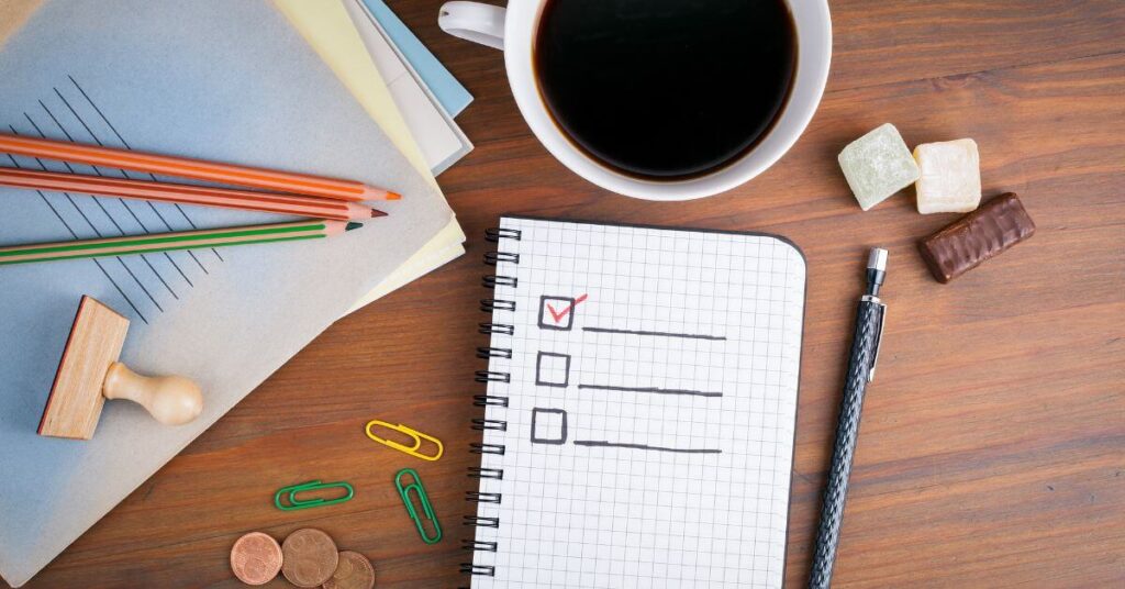 How Effective Leaders Prioritize Work - checklist, coffee, coins, papers