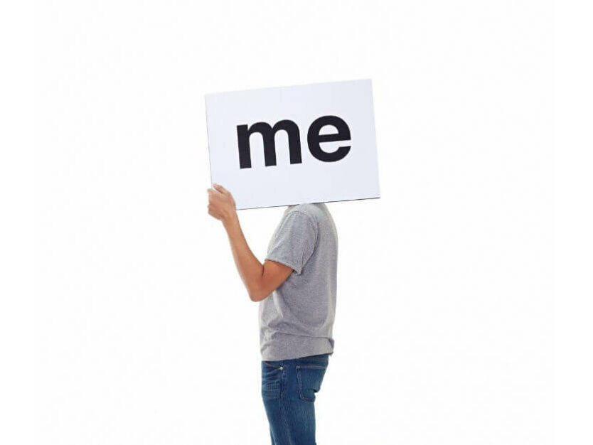 Economy of Me: Working as an independent project manager - individual holding up a sign that says 